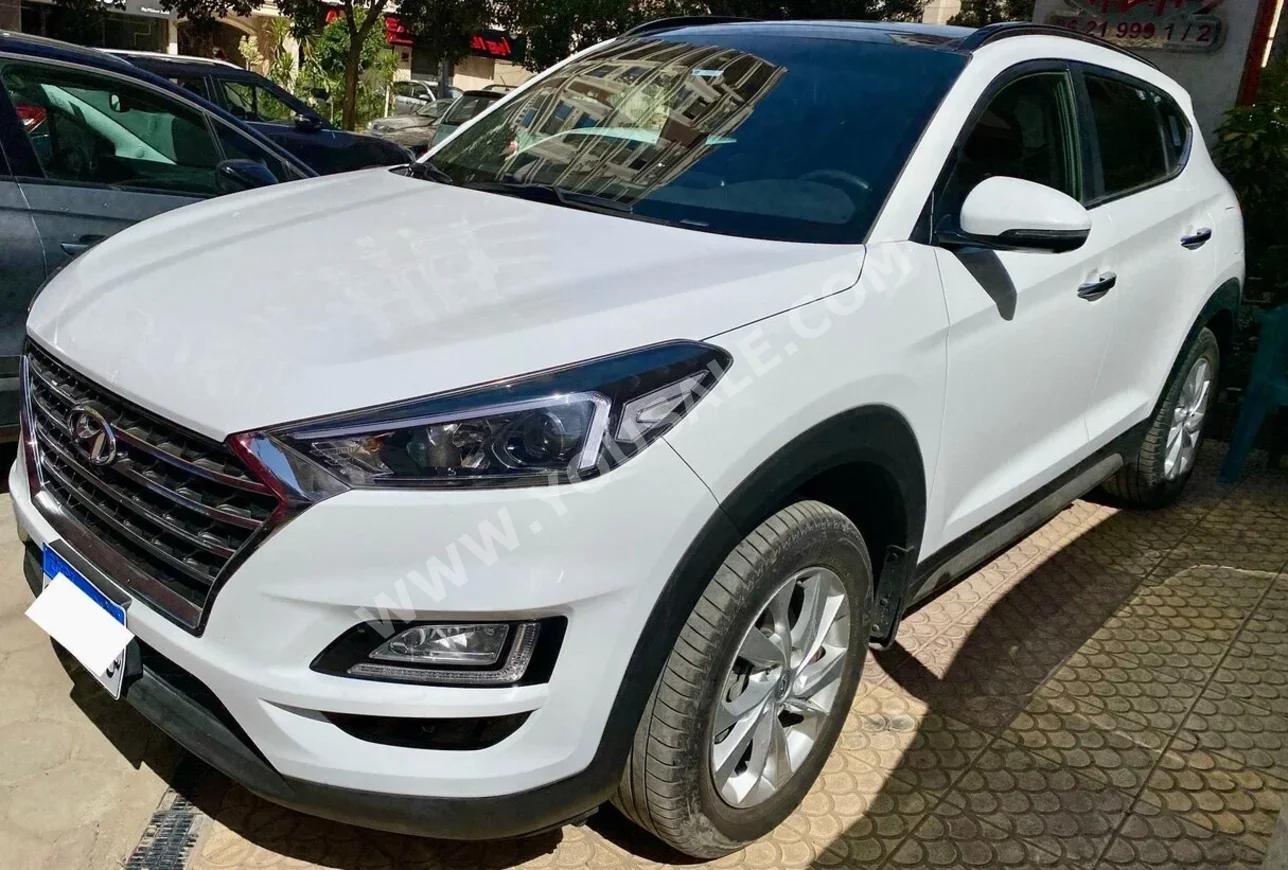 Hyundai  Tucson  2021  SUV  Automatic  4 Cylinder  90,000 Km  FWD  White  Gasoline