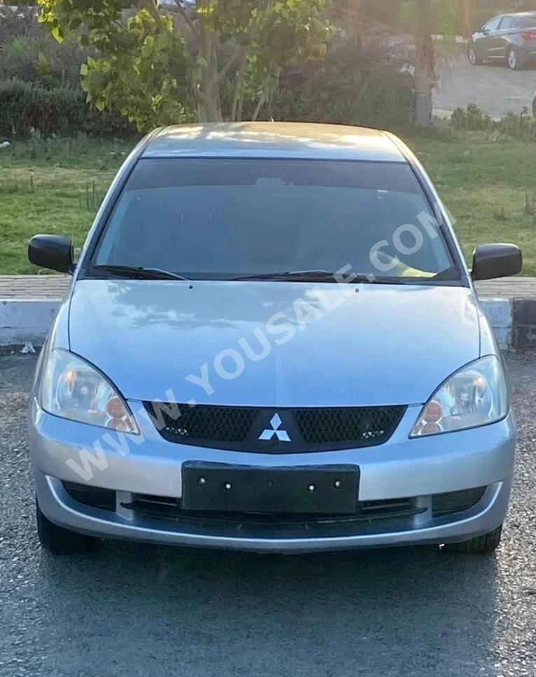 متسوبيشي  لانسر  2010  سيدان  اوتوماتيك  4 سلندر  130,000 كم  دفع أمامي  رمادي  بنزين