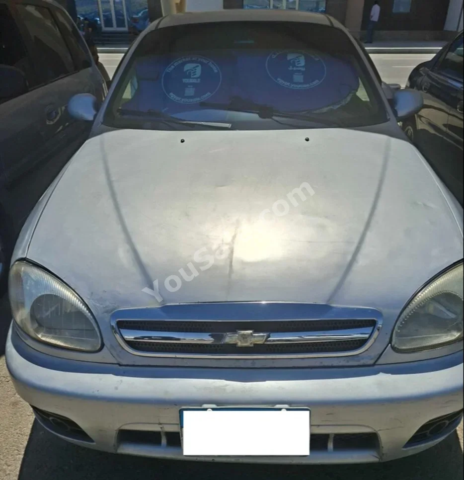دايو لانوس 2009 سيدان عادي 4 سلندر 149,000 كم دفع أمامي فضي بنزين