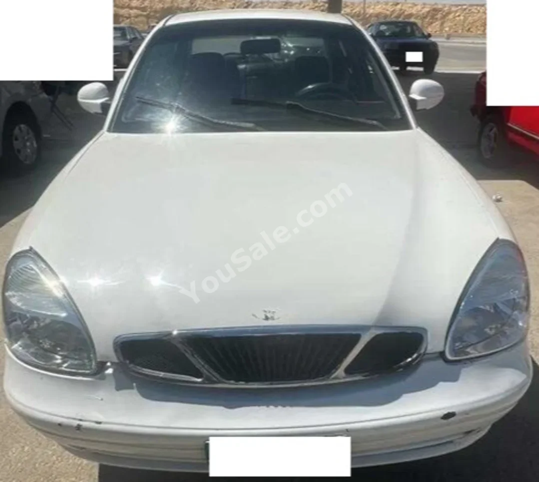 دايو نوبيرا 2001 سيدان عادي 4 سلندر 166,000 كم دفع أمامي أبيض بنزين