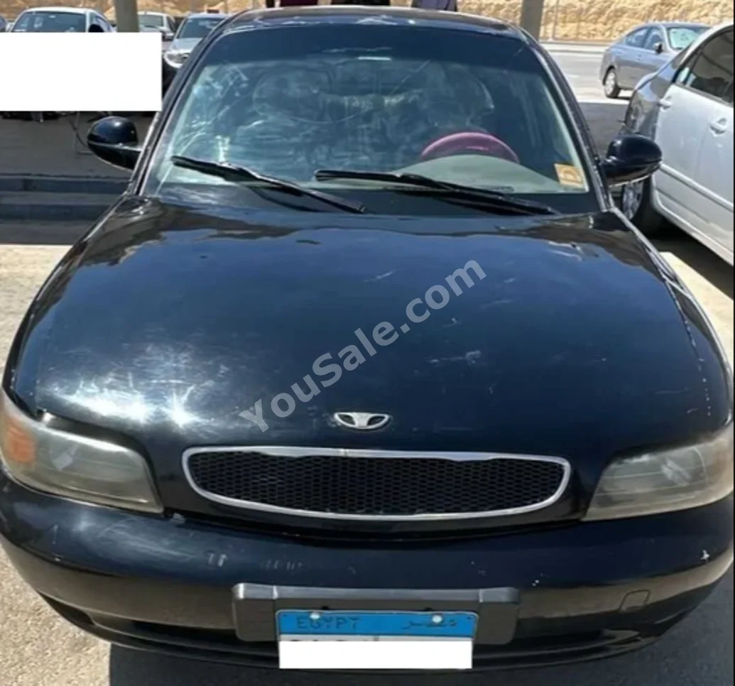 دايو نوبيرا 1998 سيدان عادي 4 سلندر 180,000 كم دفع أمامي أسود بنزين