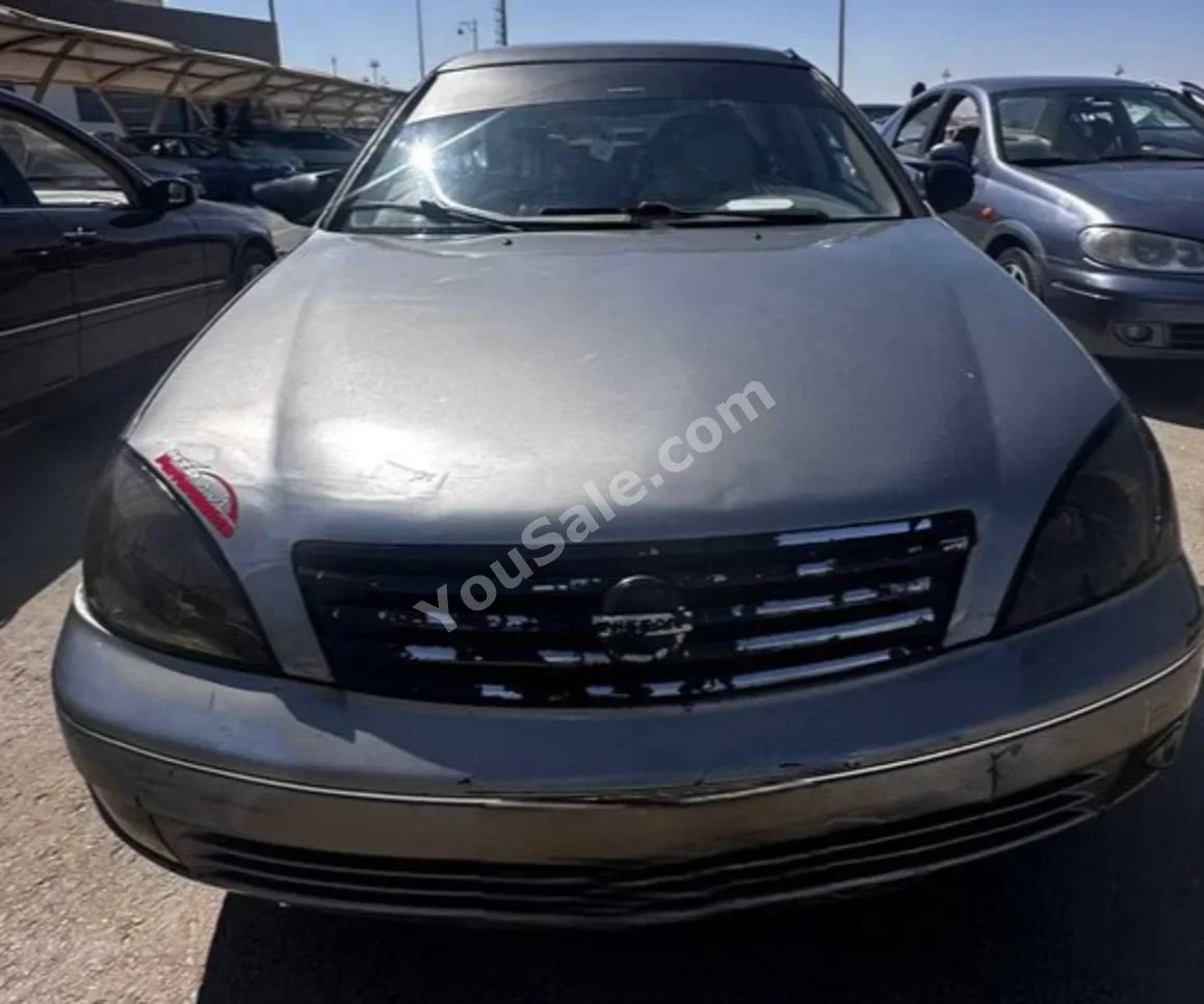 Nissan  Sunny  2010  Sedan  Automatic  4 Cylinder  203,000 Km  FWD  Silver  Gasoline