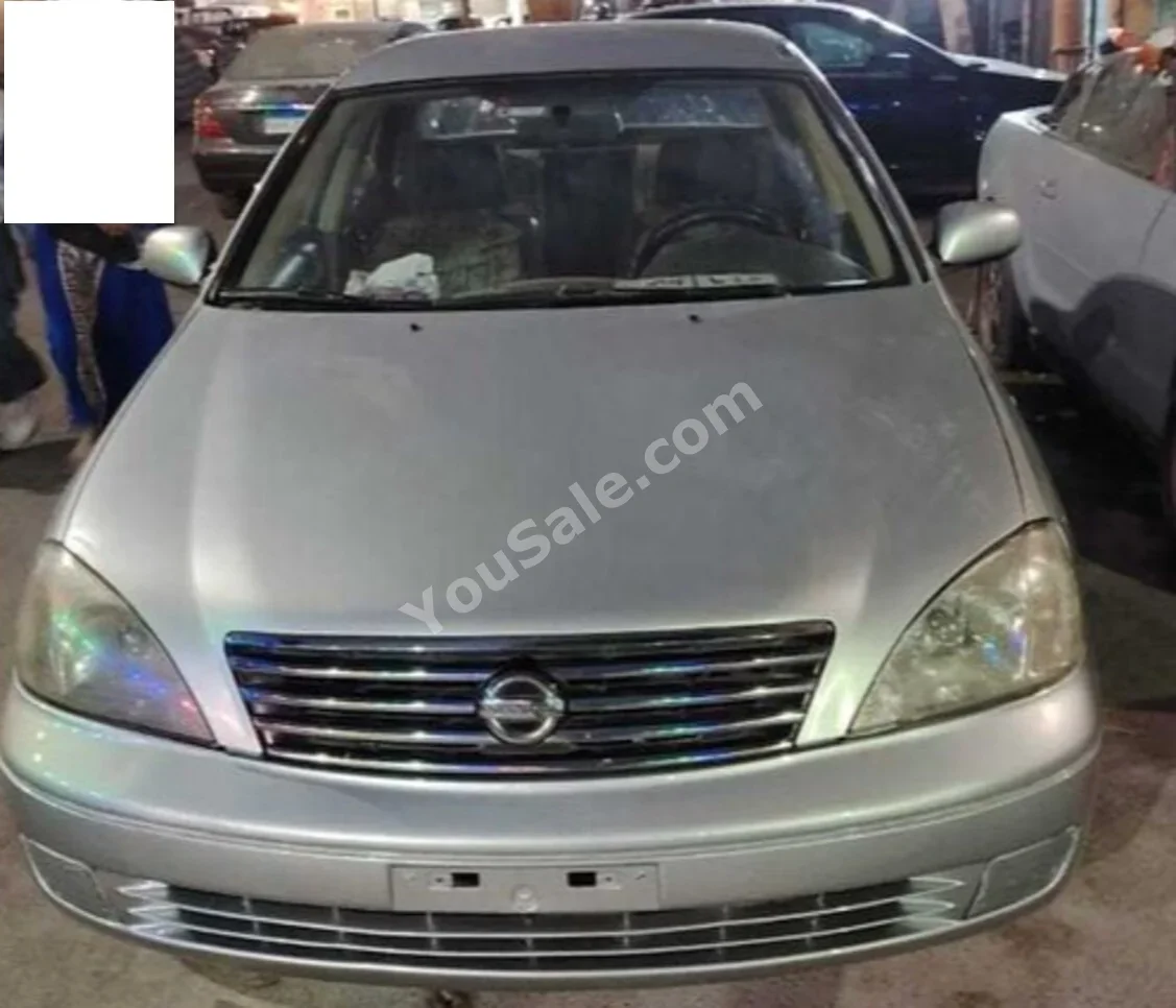 Nissan  Sunny  2009  Sedan  Automatic  4 Cylinder  124,000 Km  FWD  Silver  Gasoline