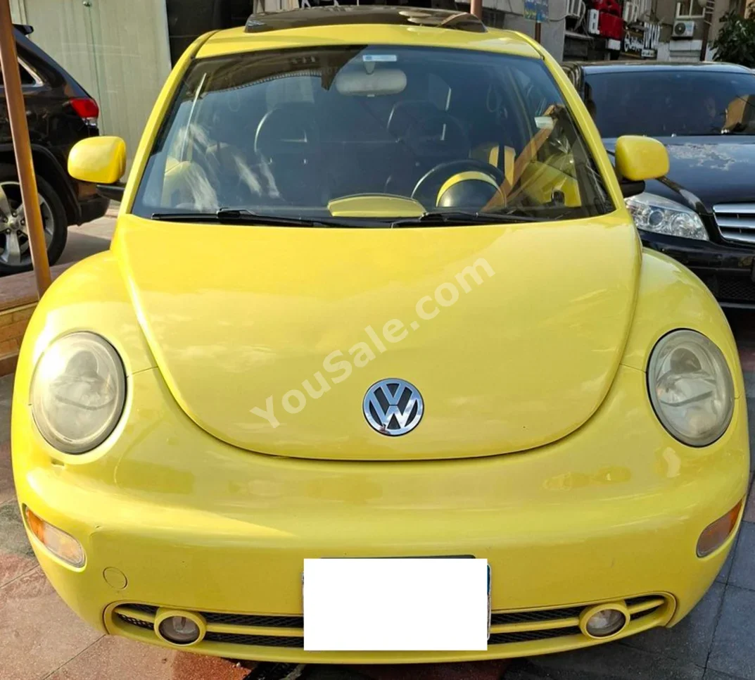 فولكس فاجن  بيتل  2001  سيدان  اوتوماتيك  4 سلندر  98,000 كم  دفع أمامي  أصفر  بنزين