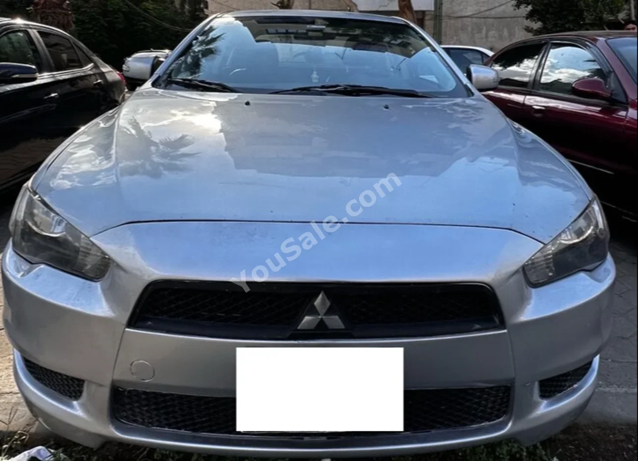 Mitsubishi  Lancer  2016  Sedan  Automatic  4 Cylinder  170,000 Km  FWD  Silver  Gasoline