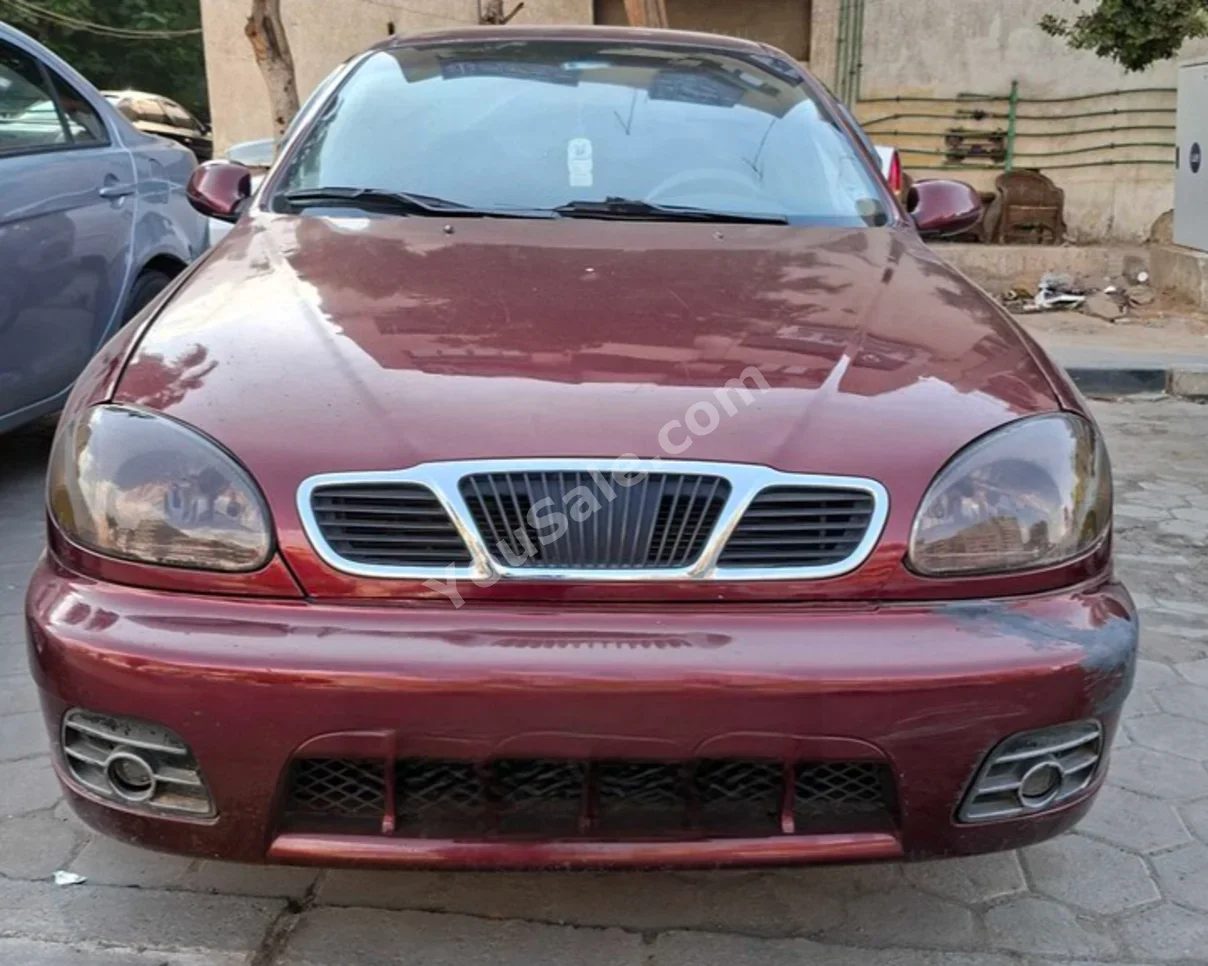 شفروليه  لانوس  2016  سيدان  عادي  4 سلندر  300,000 كم  دفع أمامي  أحمر  بنزين
