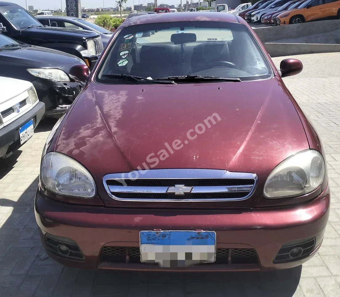 Chevrolet  Lanos  2011  Sedan  Manual  4 Cylinder  129,000 Km  FWD  Maroon  Gasoline
