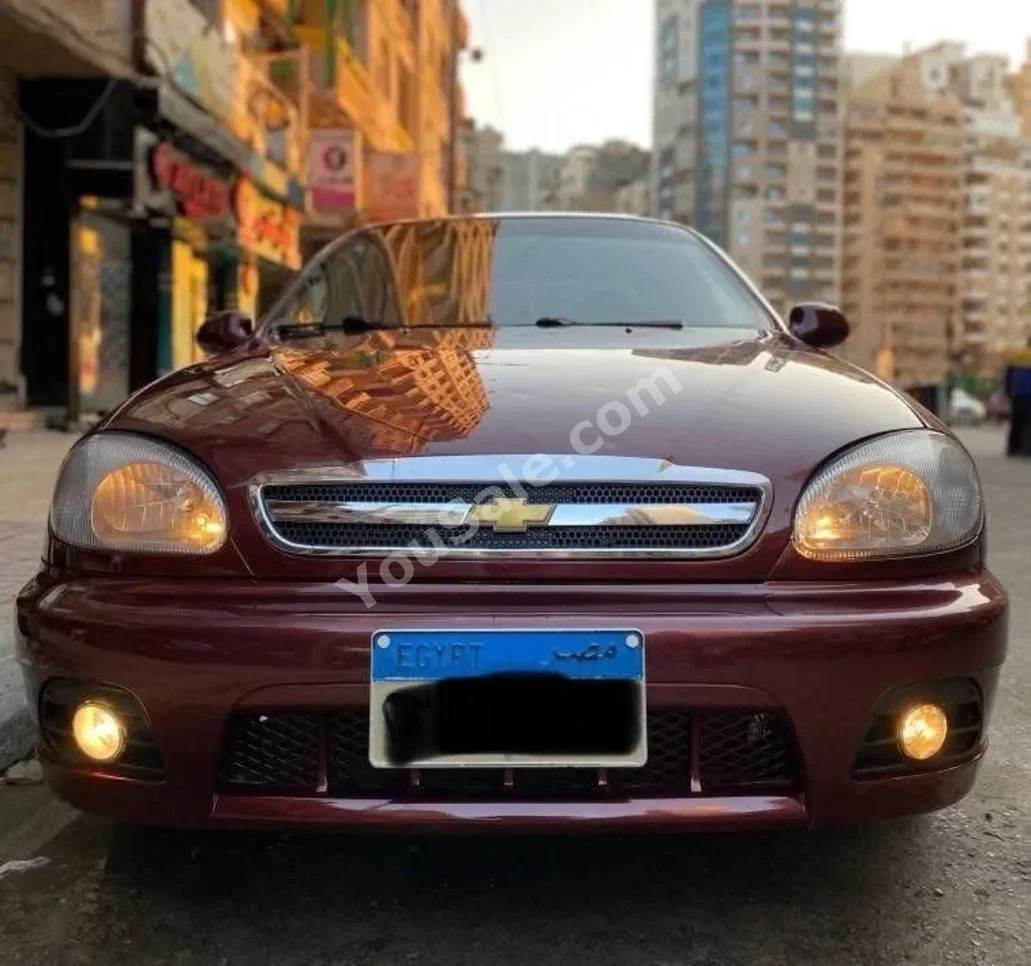 دايو لانوس 2014 سيدان عادي 4 سلندر 160,000 كم دفع أمامي أحمر بنزين