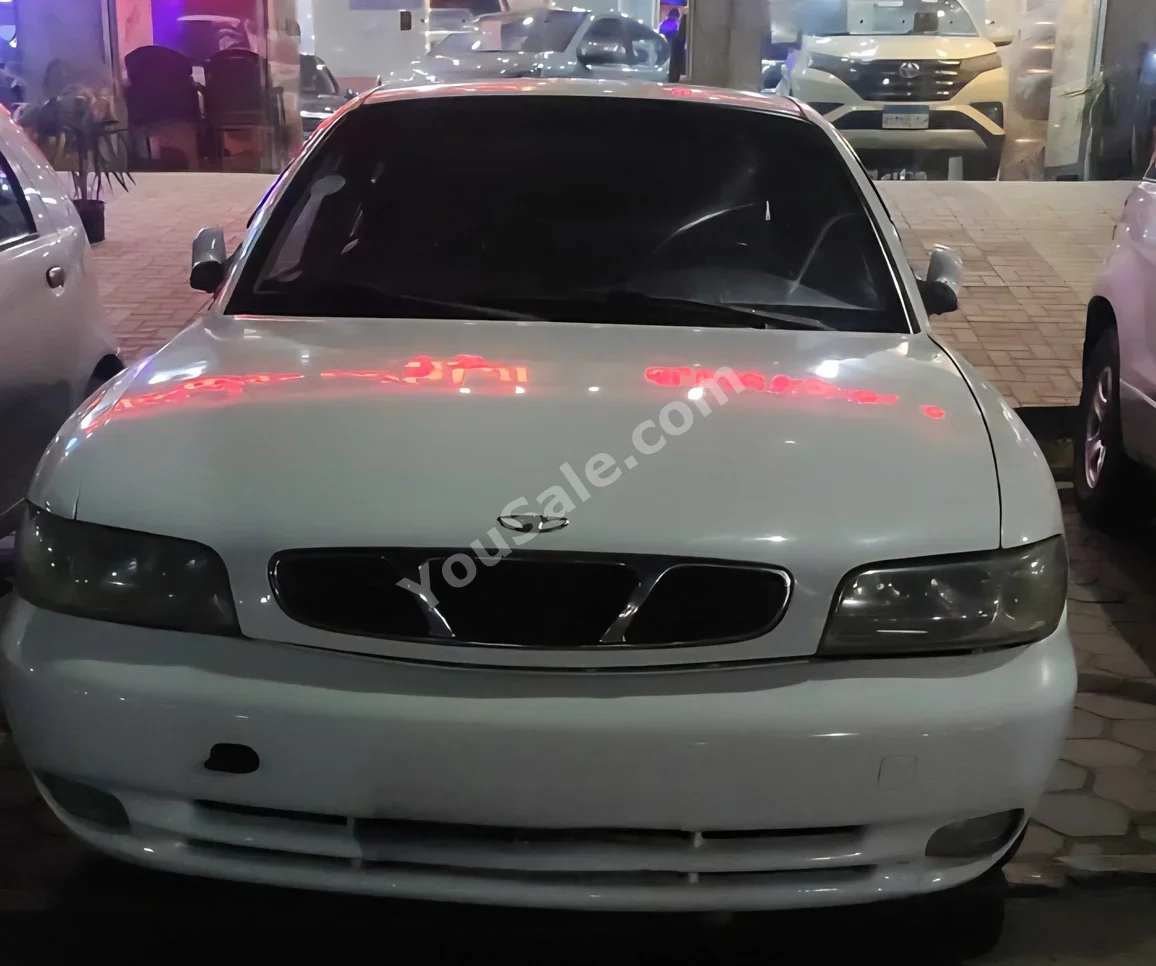 Daewoo  Nubira  1998  Sedan  Automatic  4 Cylinder  21,000 Km  FWD  White  Gasoline