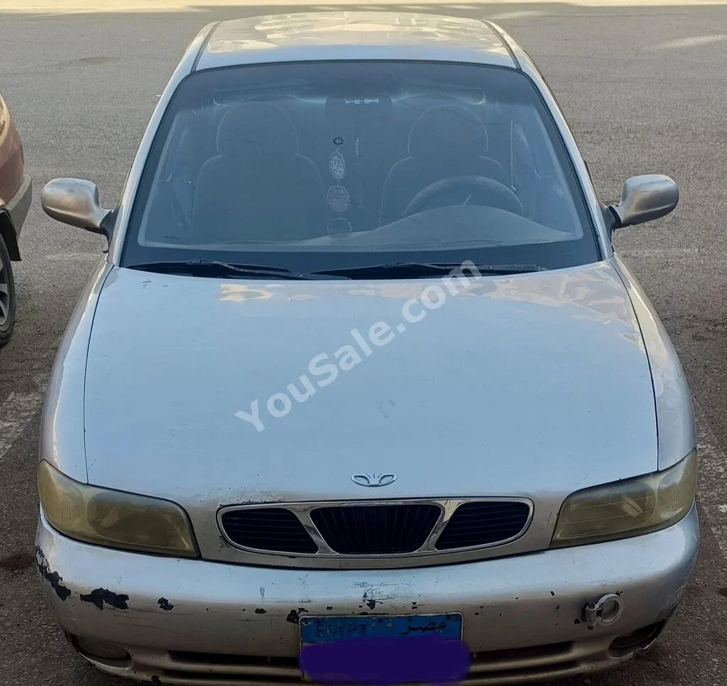 دايو نوبيرا 1998 سيدان عادي 4 سلندر 190,000 كم دفع أمامي فضي بنزين