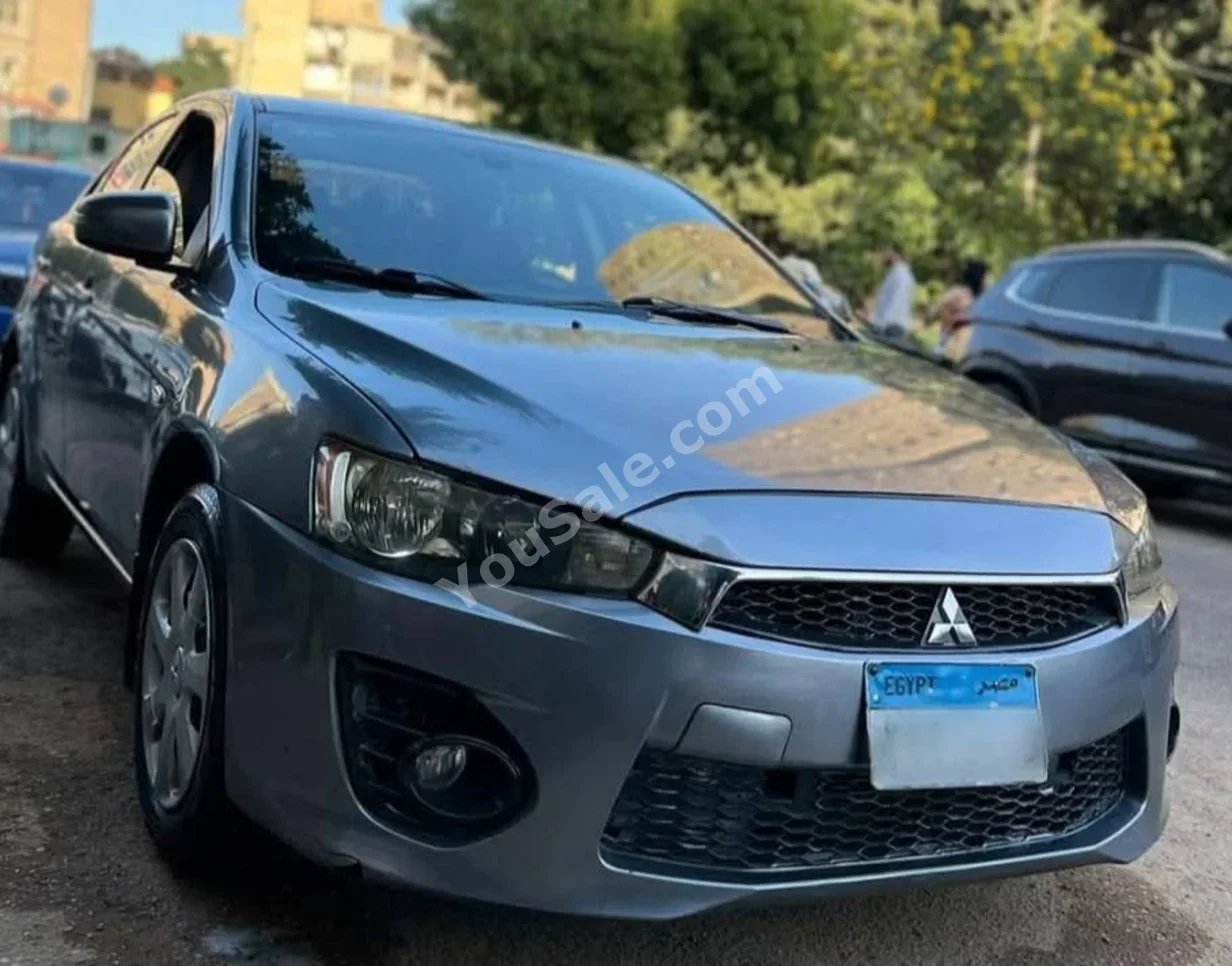 متسوبيشي  لانسر  2017  سيدان  اوتوماتيك  4 سلندر  100,000 كم  دفع أمامي  فضي  بنزين
