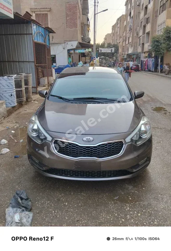 Kia  Cerato  2015  Sedan  Automatic  4 Cylinder  150,000 Km  AWD  Brown  Gasoline