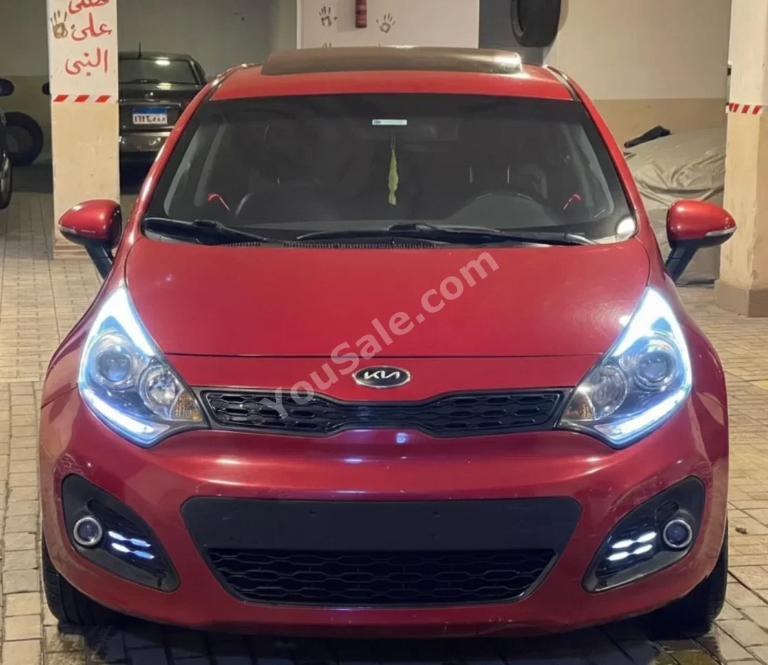 Kia Rio 2015 Hatchback Automatic 4 Cylinder 130,000 Km FWD Red Gasoline
