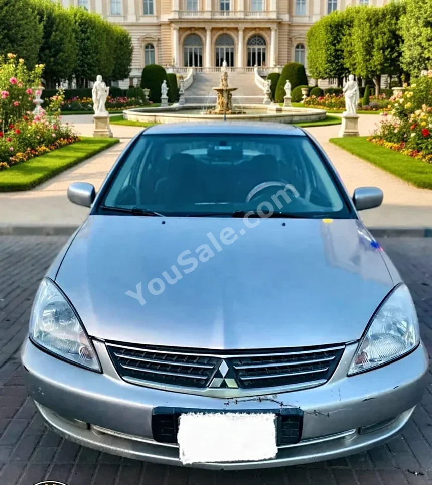 متسوبيشي لانسر 2011 سيدان اوتوماتيك 4 سلندر 330,000 كم دفع أمامي فضي بنزين