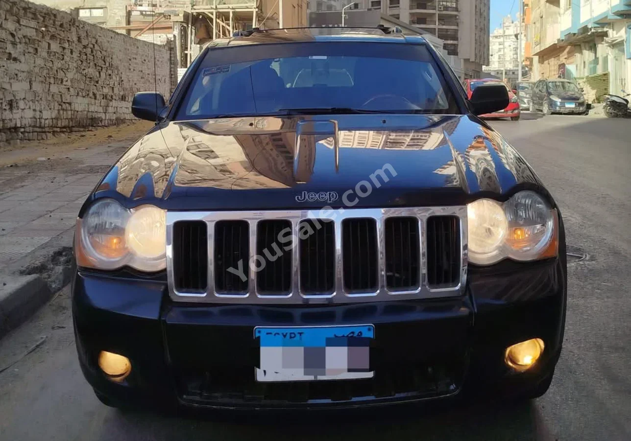 جييب جراند شيروكي 2009 اوتوماتيك 195,000 كم دفع كلي مستمر أسود بنزين