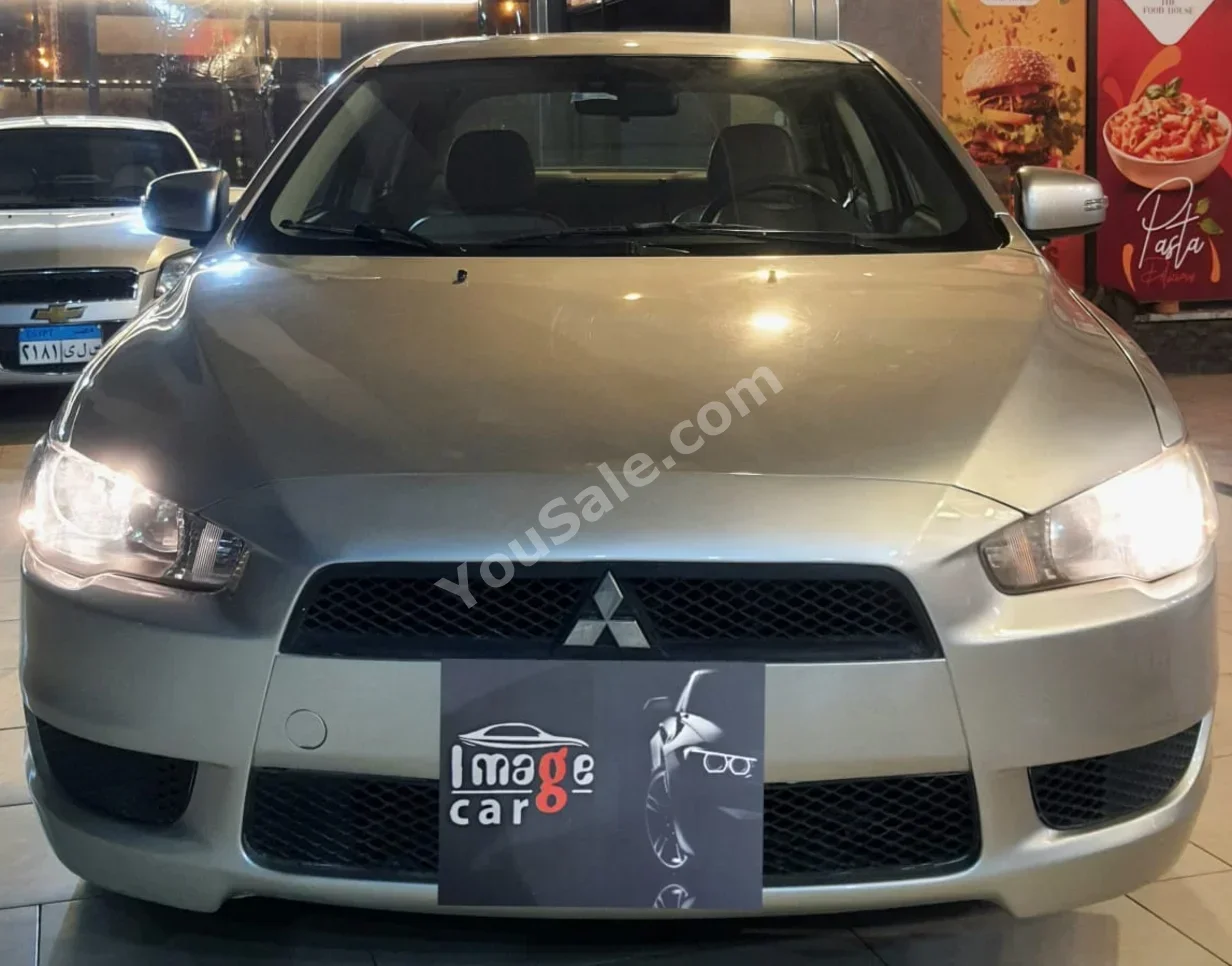 متسوبيشي  لانسر  2016  سيدان  اوتوماتيك  4 سلندر  180,000 كم  دفع أمامي  فضي  بنزين
