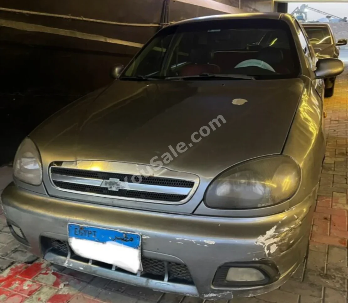 Chevrolet  Lanos  2012  Sedan  Manual  4 Cylinder  300,000 Km  FWD  Gray  Gasoline