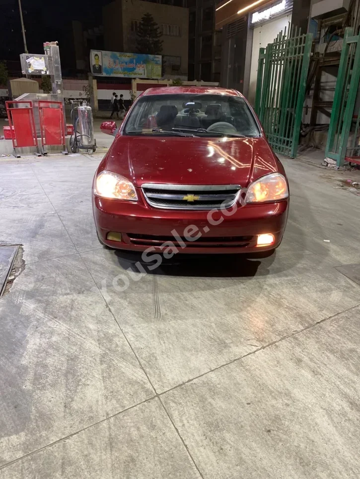 شيفروليه اوبترا 2007 سيدان اوتوماتيك 4 سلندر 220,000 كم دفع أمامي أحمر بنزين
