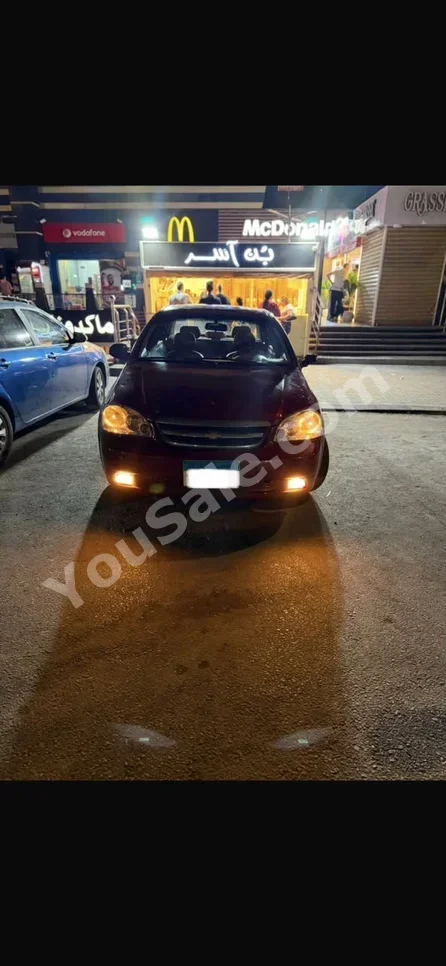 Chevrolet  Optra  2007  Sedan  Automatic  4 Cylinder  220,000 Km  FWD  Red  Gasoline